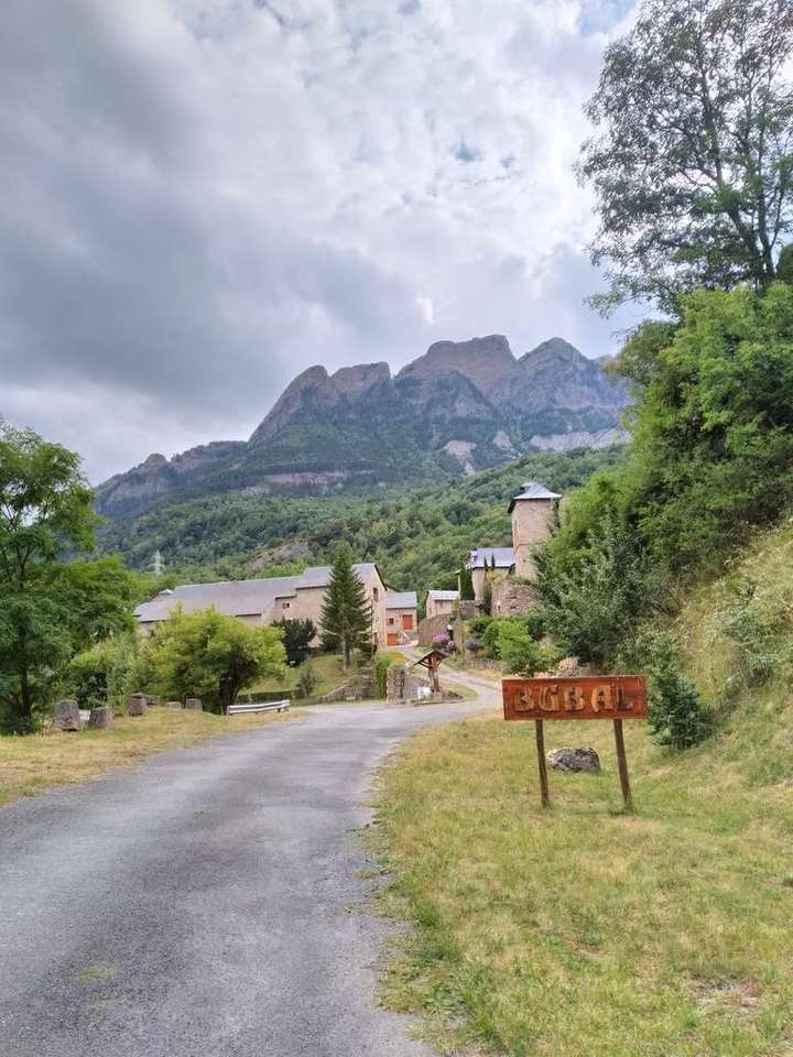 Entrance sign to an old town in the mountains near Formigal