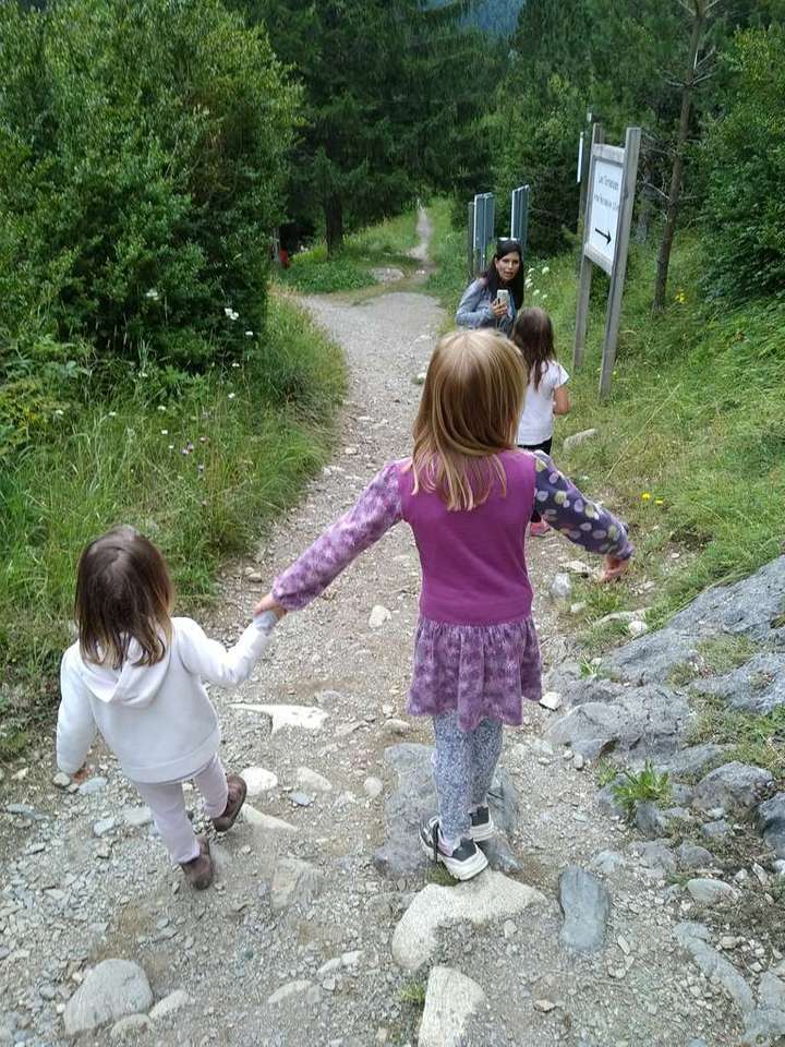 Kids walking along a mountain path